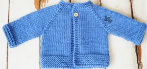 Cardigan raglan bebé primera puesta